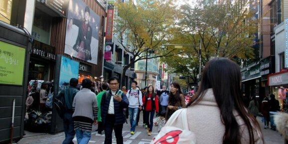 crowded shopping street in Myeongdong at night